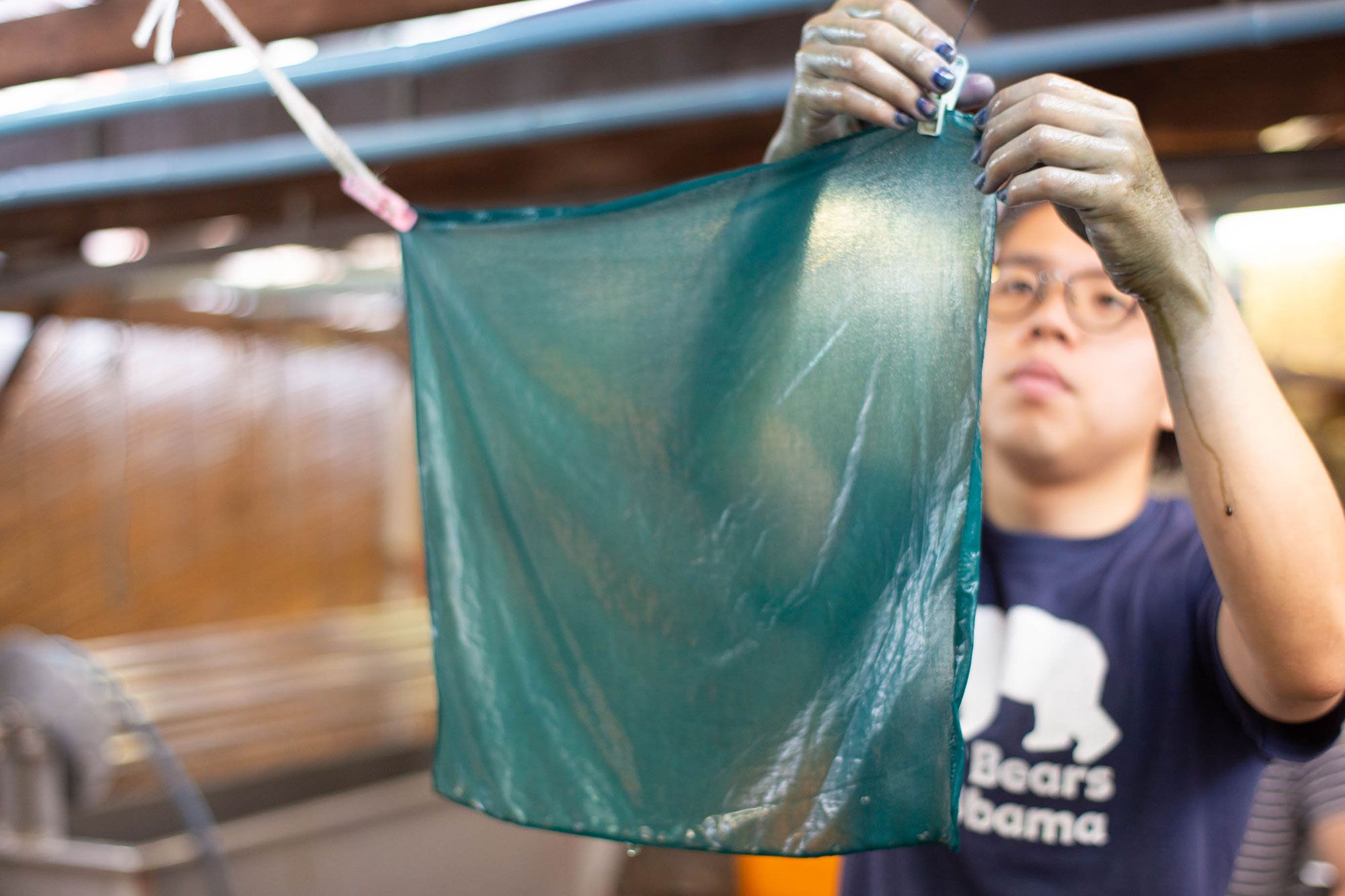 Handkerchief dyed with indigo. The hands of the craftsman are dyed as well.