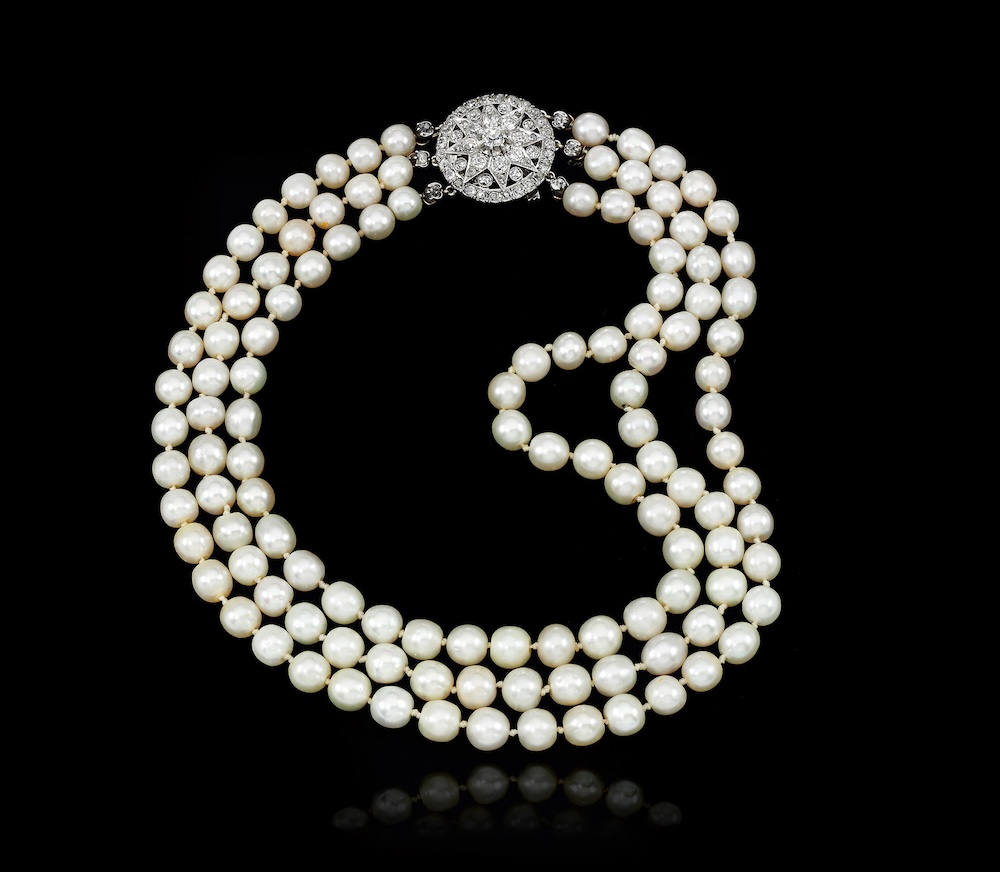 A triple-strand necklace of natural pearls and diamonds, formerly owned by Marie Antoinette.